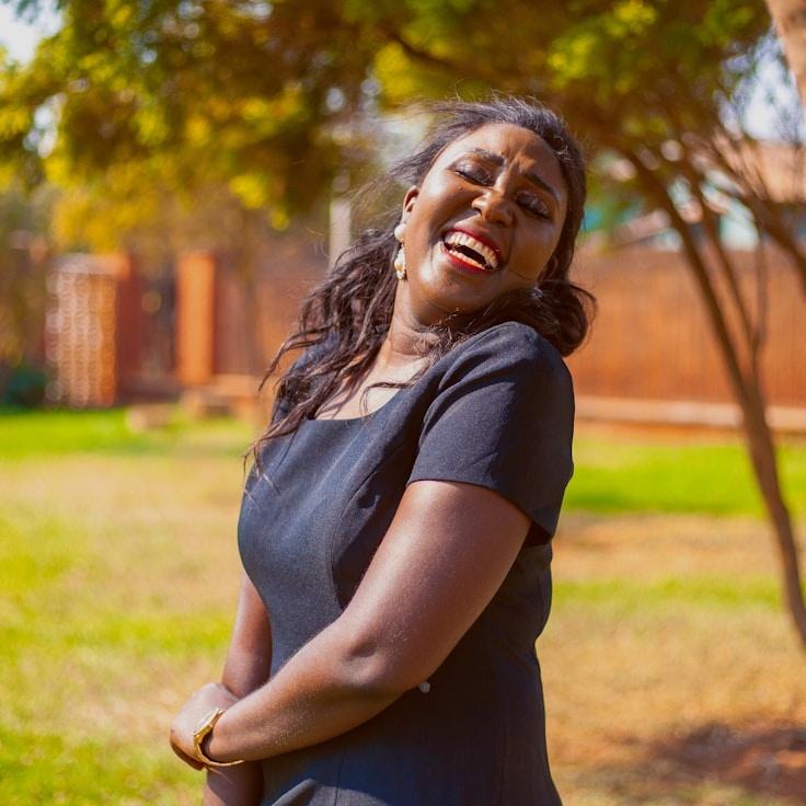 Avery Chen, Lead Design Curator at Modern System Structure, reviewing corporate floral arrangements